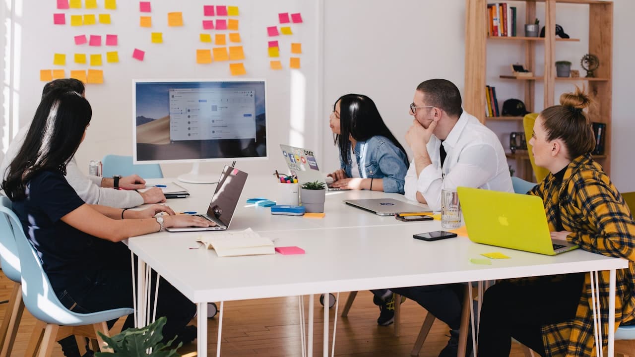 A Global Empire team working through a client problem together